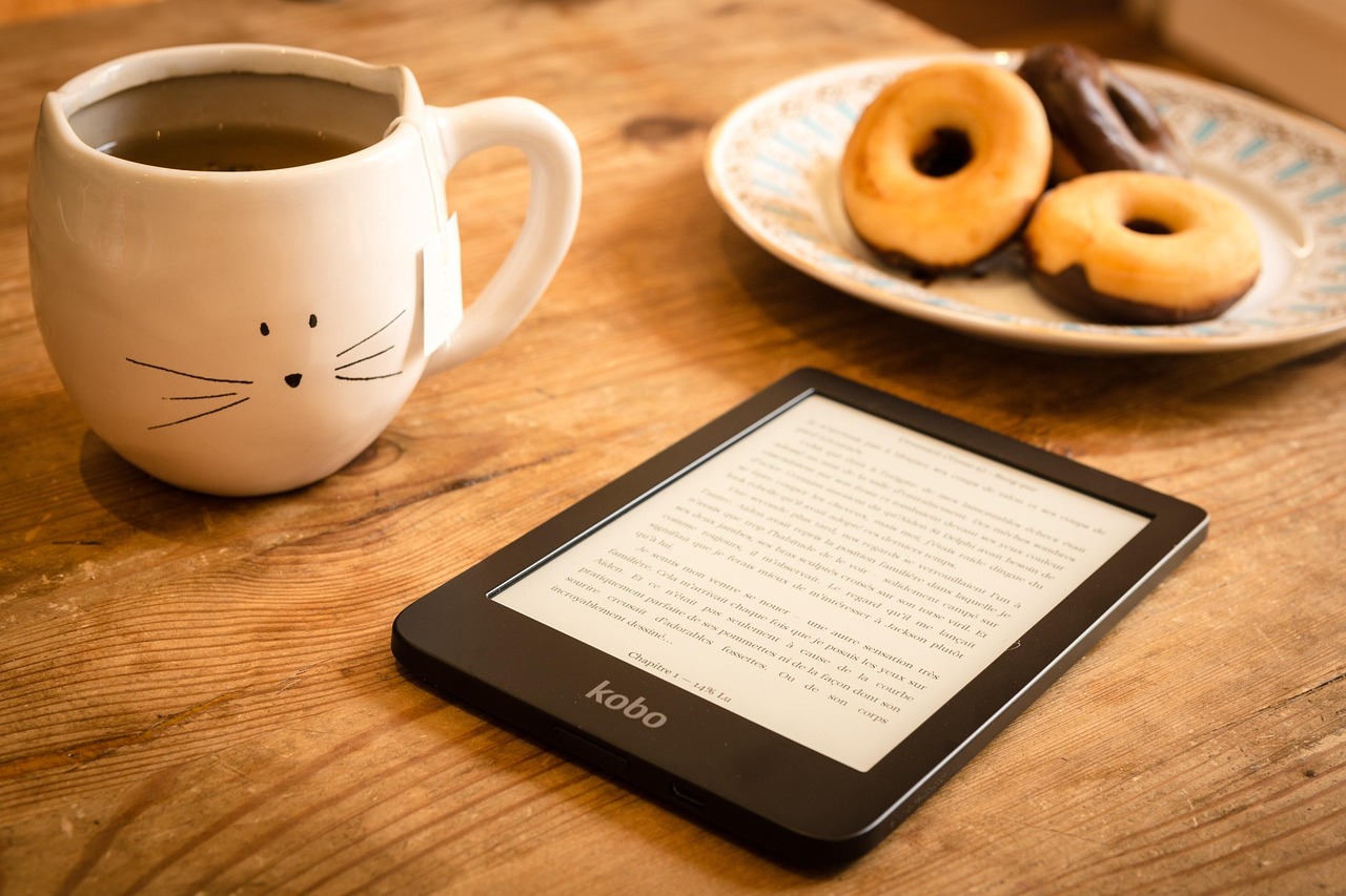 reading, refreshments, e-reader, doughnuts, donuts, dessert, tea, book, e-book, snack, reading, reading, tea, tea, book, book, book, book, book