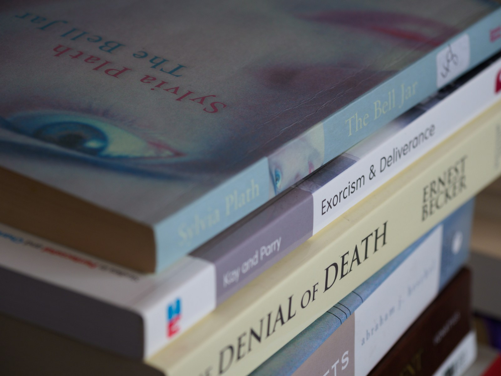 books on white wooden shelf